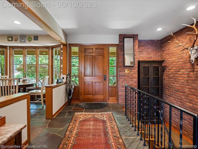 4383 Pine Tree Trl, Bloomfield Hills, MI 48302 - foyer with brick wall, stone tile flooring, and recessed lighting