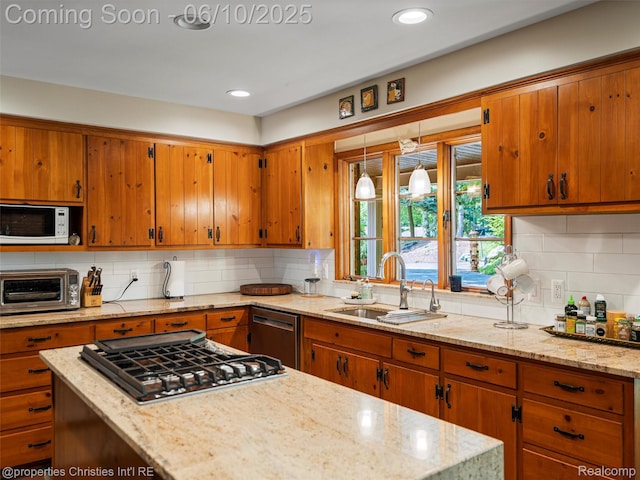 4383 Pine Tree Trl, Bloomfield Hills, MI 48302 - kitchen featuring a sink, appliances with stainless steel finishes, brown cabinets, decorative backsplash, and light stone counters