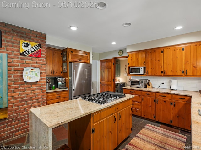4383 Pine Tree Trl, Bloomfield Hills, MI 48302 - kitchen featuring stainless steel appliances, backsplash, a kitchen island, brown cabinets, and light stone countertops