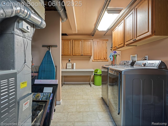4383 Pine Tree Trl, Bloomfield Hills, MI 48302 - washroom with washer and clothes dryer, cabinet space, stone finish floors, and baseboards