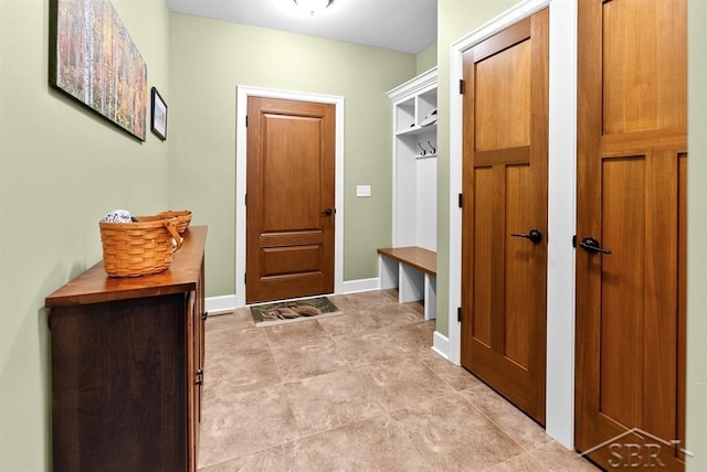 2887 E Iron Woods Pass, Midland, MI 48642 - mudroom featuring baseboards