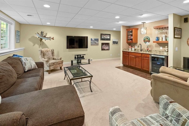 2887 E Iron Woods Pass, Midland, MI 48642 - living area with beverage cooler, wet bar, carpet flooring, baseboards, and recessed lighting