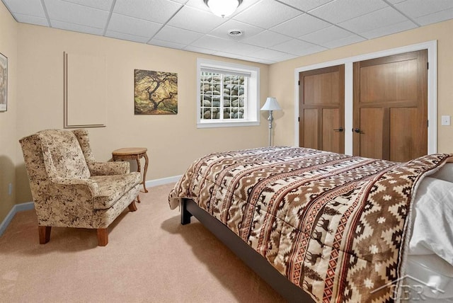 2887 E Iron Woods Pass, Midland, MI 48642 - carpeted bedroom featuring baseboards and a paneled ceiling
