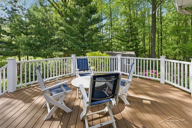 2887 E Iron Woods Pass, Midland, MI 48642 - wooden terrace featuring a fire pit