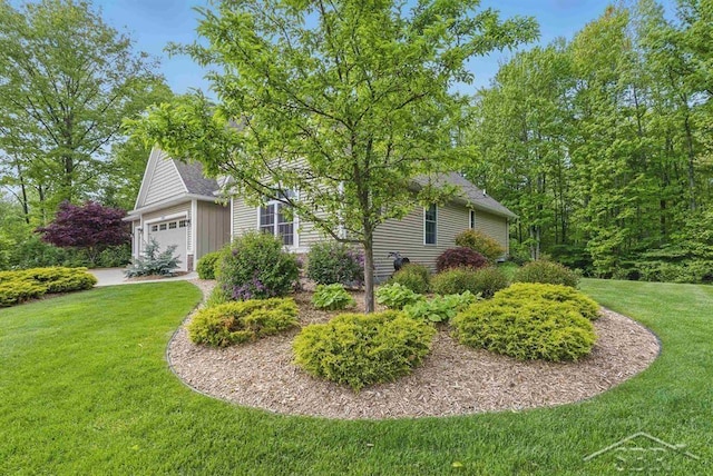 2887 E Iron Woods Pass, Midland, MI 48642 - view of side of property featuring a yard, a garage, board and batten siding, and a shingled roof