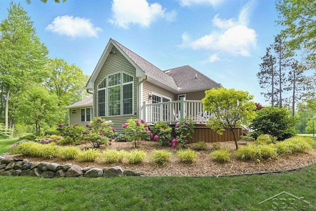2887 E Iron Woods Pass, Midland, MI 48642 - rear view of property with a deck, a lawn, and a shingled roof