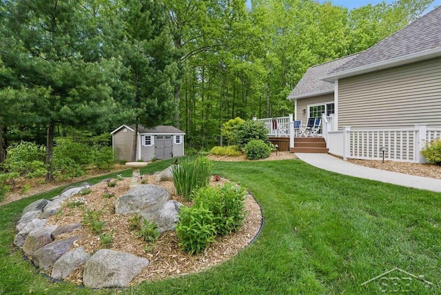 2887 E Iron Woods Pass, Midland, MI 48642 - view of grassy yard with a deck