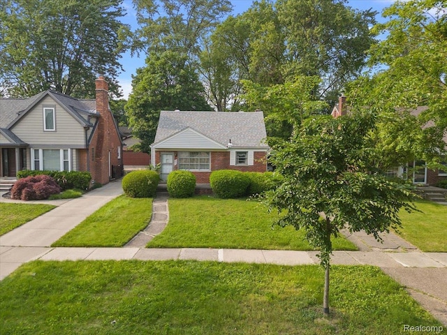 2829 Dorchester Rd, Birmingham, MI 48009 - view of front of home featuring a front yard and brick siding