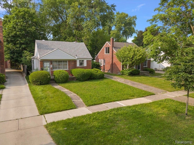 2829 Dorchester Rd, Birmingham, MI 48009 - bungalow-style home featuring a front yard and brick siding