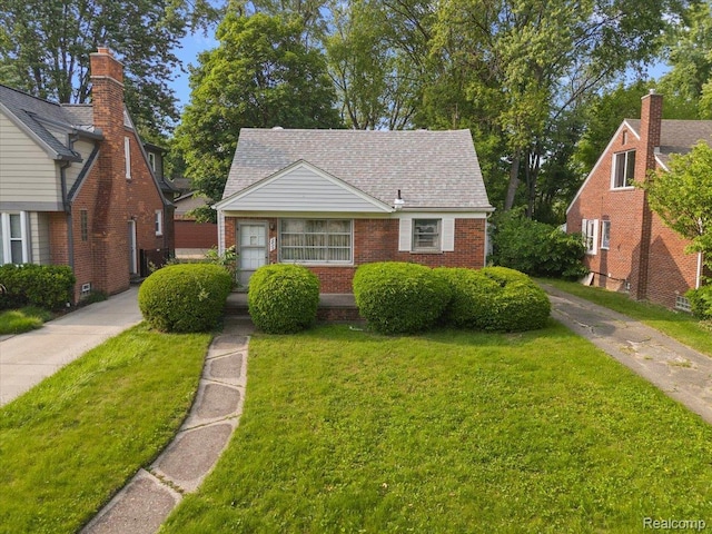 2829 Dorchester Rd, Birmingham, MI 48009 - view of front facade featuring a front lawn, brick siding, and a shingled roof
