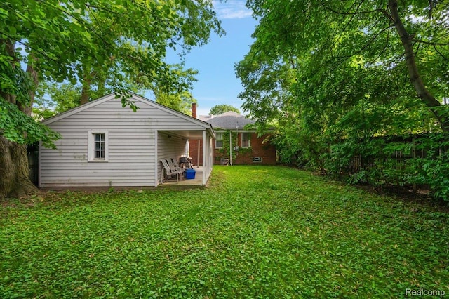 2829 Dorchester Rd, Birmingham, MI 48009 - view of grassy yard featuring a patio