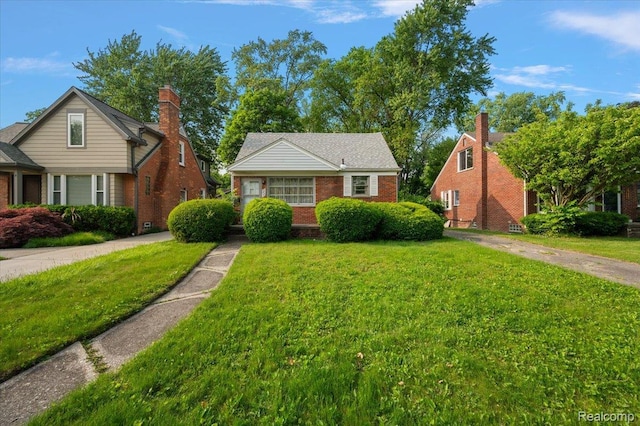 2829 Dorchester Rd, Birmingham, MI 48009 - bungalow featuring a front yard and brick siding