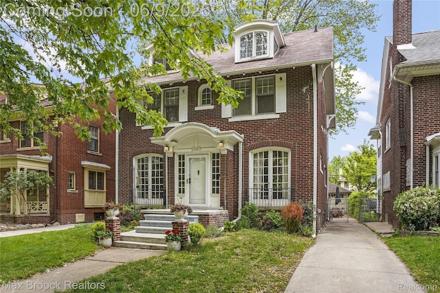 2444 Edison St, Detroit, MI 48206 - view of front of home with brick siding and a front lawn