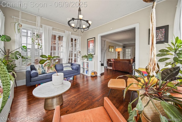 2444 Edison St, Detroit, MI 48206 - living room with ornamental molding, wood finished floors, a chandelier, and baseboards