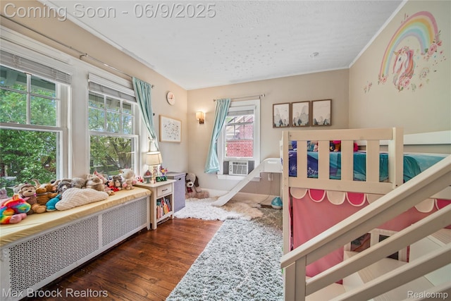 2444 Edison St, Detroit, MI 48206 - bedroom featuring wood finished floors, radiator, and a textured ceiling