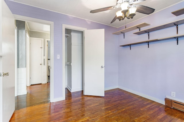 74219 Lambert Dr, South Haven, MI 49090 - unfurnished bedroom with wood finished floors, baseboards, and crown molding