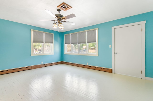 74219 Lambert Dr, South Haven, MI 49090 - spare room with ceiling fan, wood finished floors, and baseboards