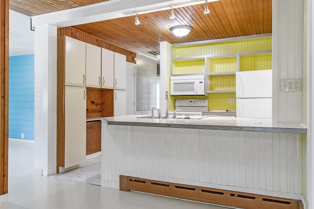 74219 Lambert Dr, South Haven, MI 49090 - kitchen with white appliances, a baseboard heating unit, open shelves, track lighting, and white cabinets