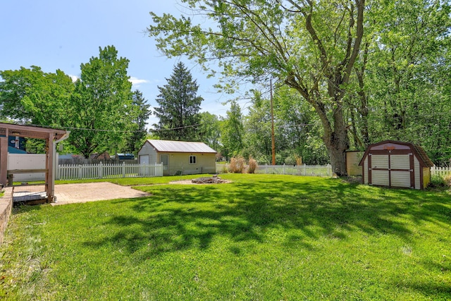 74219 Lambert Dr, South Haven, MI 49090 - view of yard featuring a patio area and a fire pit