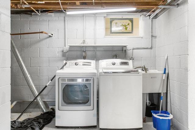 74219 Lambert Dr, South Haven, MI 49090 - laundry area featuring washer and clothes dryer and concrete block wall
