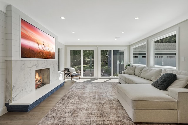 660 Sylvanwood Dr, Troy, MI 48085 - living area featuring plenty of natural light, a premium fireplace, recessed lighting, and wood finished floors
