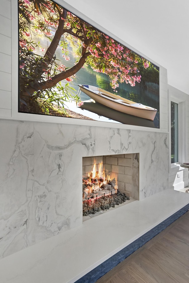 660 Sylvanwood Dr, Troy, MI 48085 - detailed view of a premium fireplace and wood finished floors