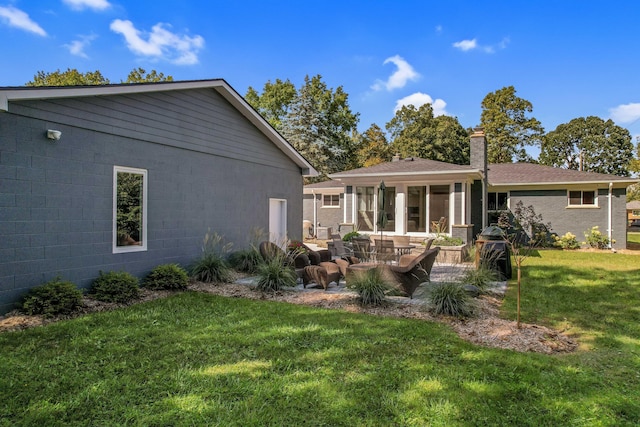 660 Sylvanwood Dr, Troy, MI 48085 - rear view of property featuring a lawn, an outdoor hangout area, a patio, and a chimney