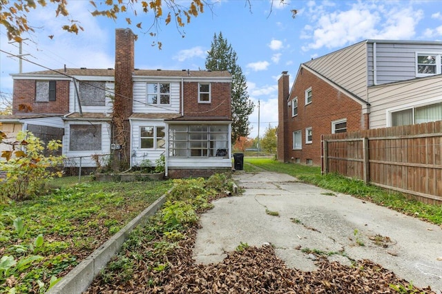 504 Alter Rd, Detroit, MI 48215 - rear view of property featuring a chimney