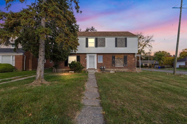 504 Alter Rd, Detroit, MI 48215 - view of front facade with brick siding and a yard