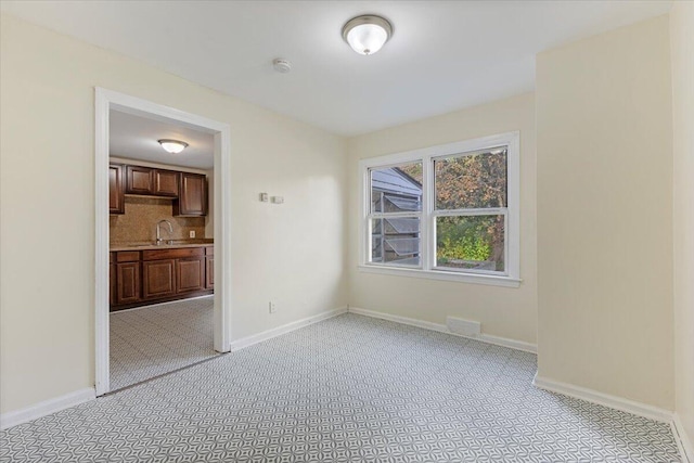 504 Alter Rd, Detroit, MI 48215 - spare room featuring baseboards and a smoke detector