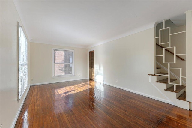 504 Alter Rd, Detroit, MI 48215 - spare room with stairway, wood-type flooring, and baseboards