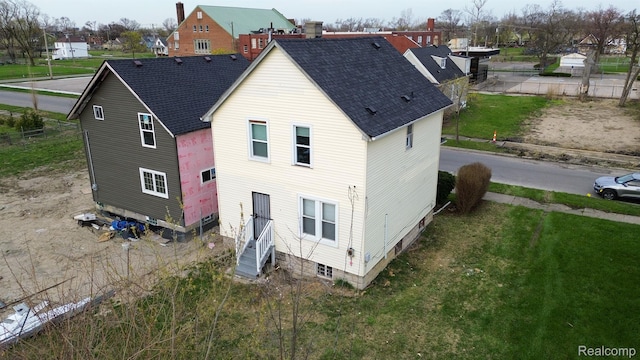 6052 Hartford St, Detroit, MI 48210 - rear view of property with entry steps and roof with shingles