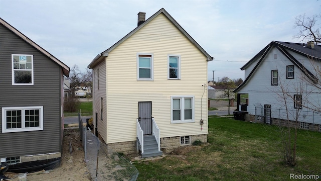 6052 Hartford St, Detroit, MI 48210 - rear view of house with entry steps and a chimney