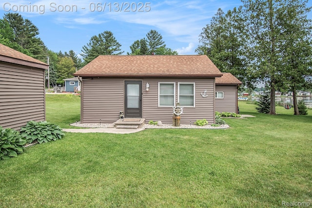 8515 Old State Ave, Farwell, MI 48622 - view of front facade featuring a front yard and a shingled roof