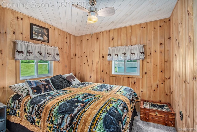 8515 Old State Ave, Farwell, MI 48622 - carpeted bedroom featuring wood walls, wood ceiling, and ceiling fan