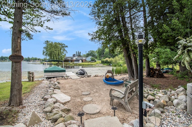 8515 Old State Ave, Farwell, MI 48622 - view of yard with a boat dock and a water view