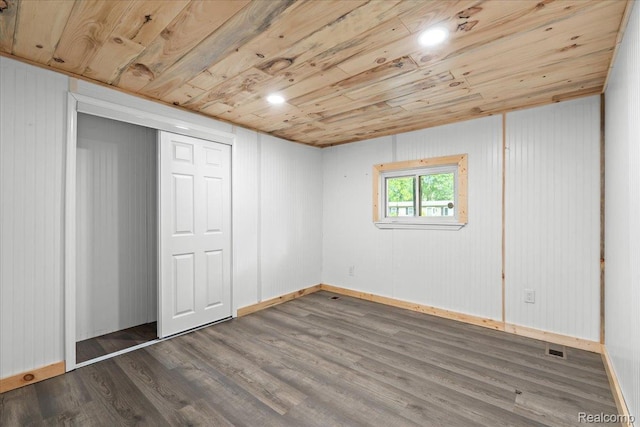 1060 Apple Blossom Dr, Howell, MI 48843 - unfurnished bedroom with wooden ceiling, dark wood-type flooring, baseboards, and a closet