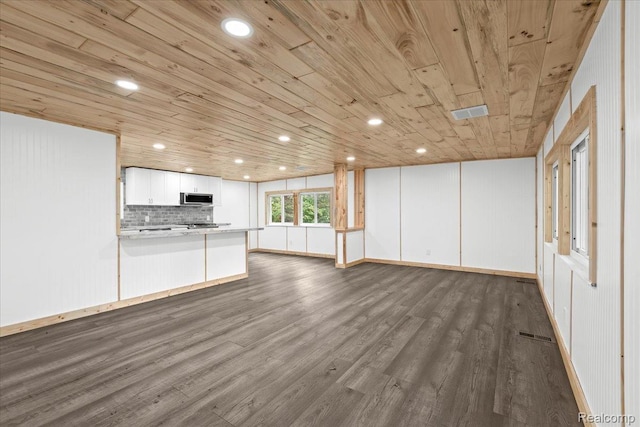 1060 Apple Blossom Dr, Howell, MI 48843 - unfurnished living room with wooden ceiling, dark wood-type flooring, recessed lighting, and baseboards