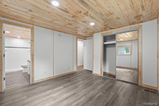 1060 Apple Blossom Dr, Howell, MI 48843 - unfurnished bedroom with wood ceiling, wood finished floors, ensuite bathroom, and a closet