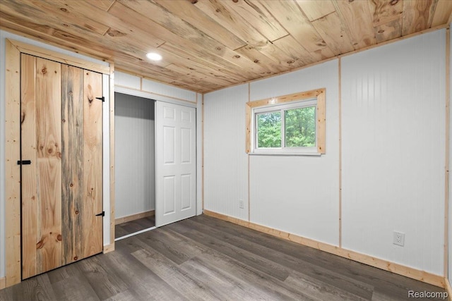 1060 Apple Blossom Dr, Howell, MI 48843 - unfurnished bedroom with wood ceiling, wood finished floors, baseboards, and a closet