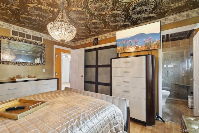 8286 Westminster Ave, Warren, MI 48089 - bedroom featuring wood finished floors, a chandelier, an ornate ceiling, and ensuite bath