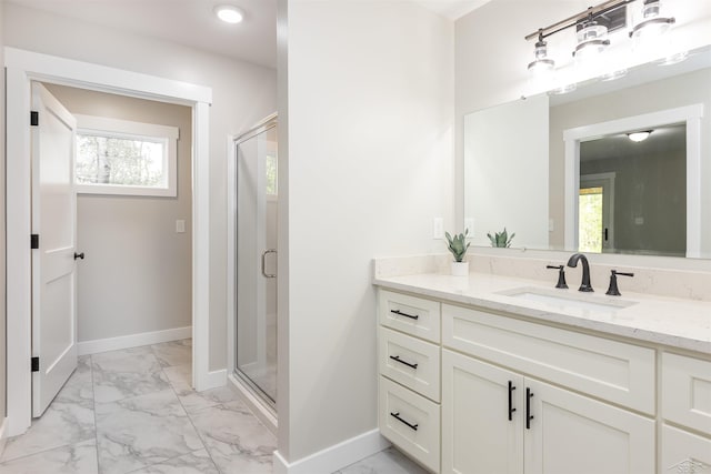 2291 E Maple Rd, Clare, MI 48617 - full bathroom featuring marble look tile flooring, vanity, a stall shower, and baseboards