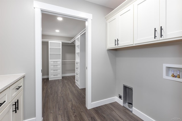 2291 E Maple Rd, Clare, MI 48617 - laundry room with cabinet space, washer hookup, dark wood-style floors, electric dryer hookup, and recessed lighting