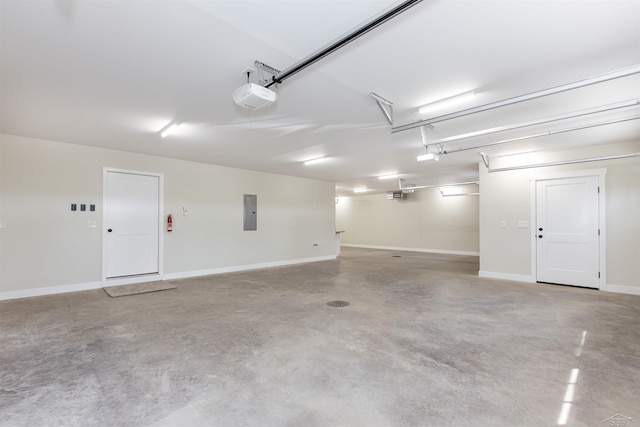 2291 E Maple Rd, Clare, MI 48617 - garage with electric panel, a garage door opener, and baseboards