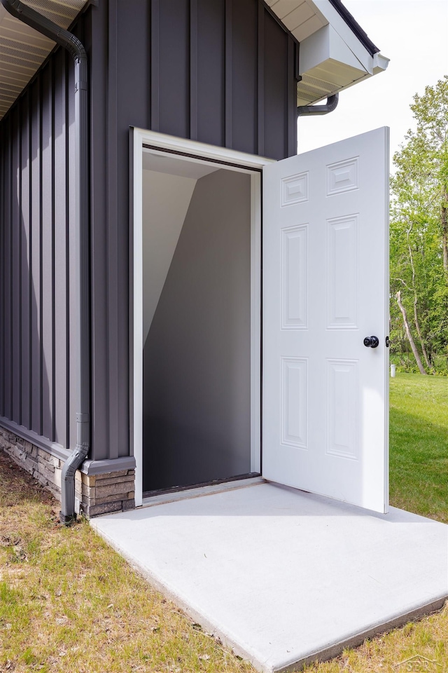 2291 E Maple Rd, Clare, MI 48617 - property entrance with board and batten siding