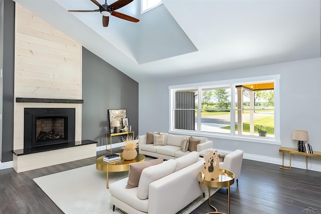 2291 E Maple Rd, Clare, MI 48617 - living area featuring a ceiling fan, a large fireplace, dark wood finished floors, and baseboards