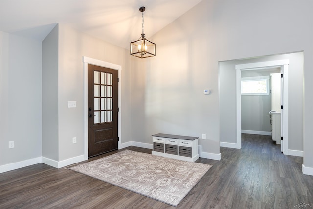 2291 E Maple Rd, Clare, MI 48617 - foyer entrance with a chandelier, dark wood-style flooring, and baseboards