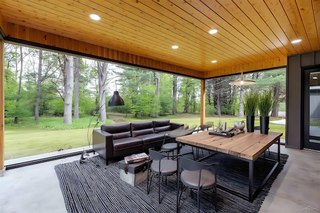 2291 E Maple Rd, Clare, MI 48617 - sunroom featuring view of scattered trees