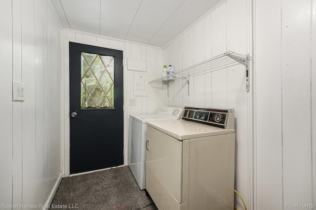 9689 Pine Ln, Evart, MI 49631 - laundry room with washing machine and dryer, carpet flooring, and wooden walls