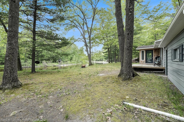 9689 Pine Ln, Evart, MI 49631 - view of yard featuring a wooden deck